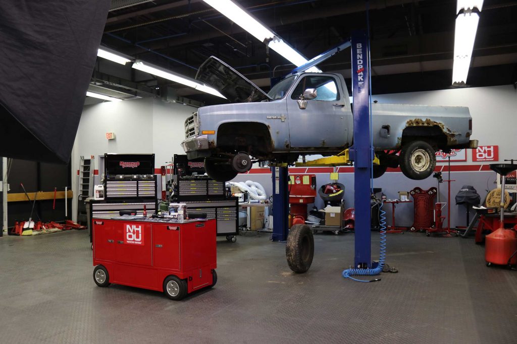 Chevy C10 square body up on a lift